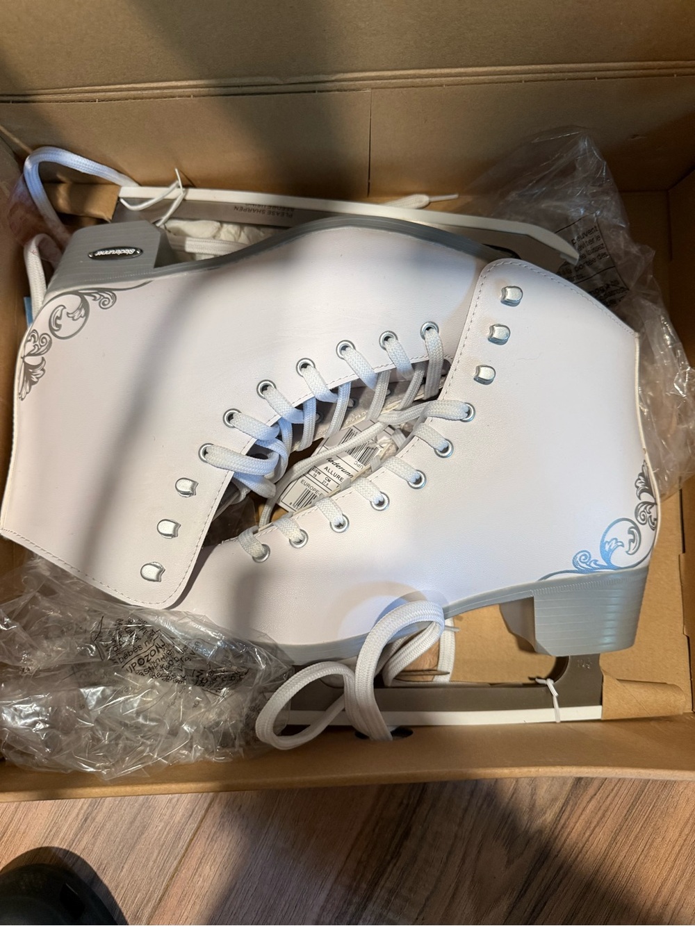 Women's White Lace-Up Ice Skates with Subtle Gray Scroll Accents